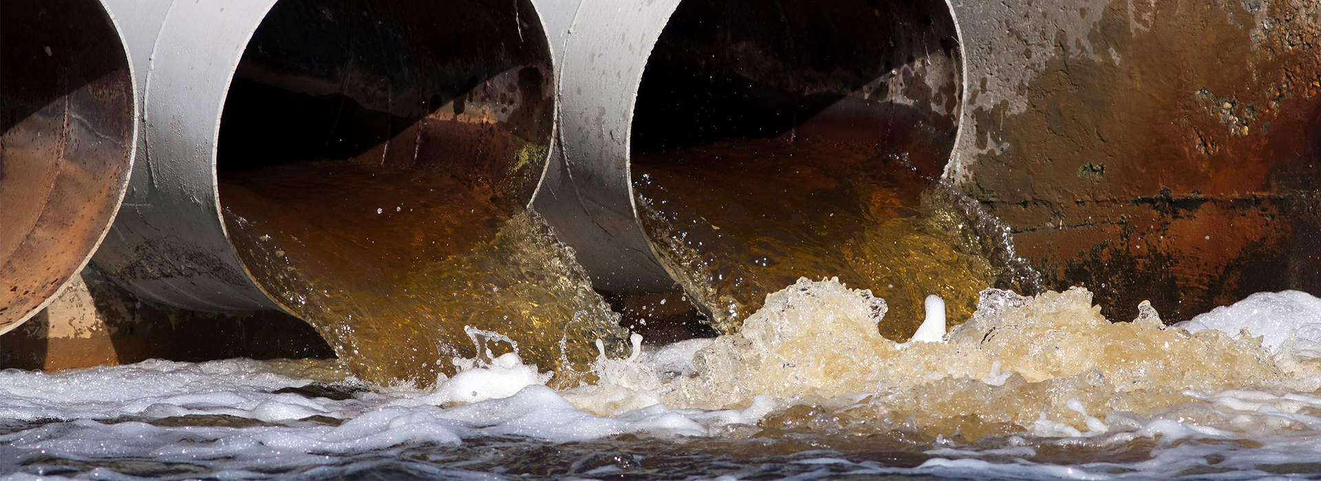 Effluent rushes out of large pipes