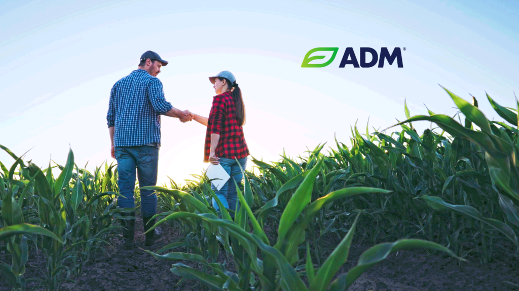 agronomist consultation - photo of man and woman shaking hands in a corn field